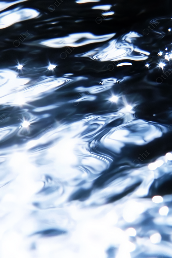 Abstract Light Reflections on Rippling Water Surface With High Contrast Highlights