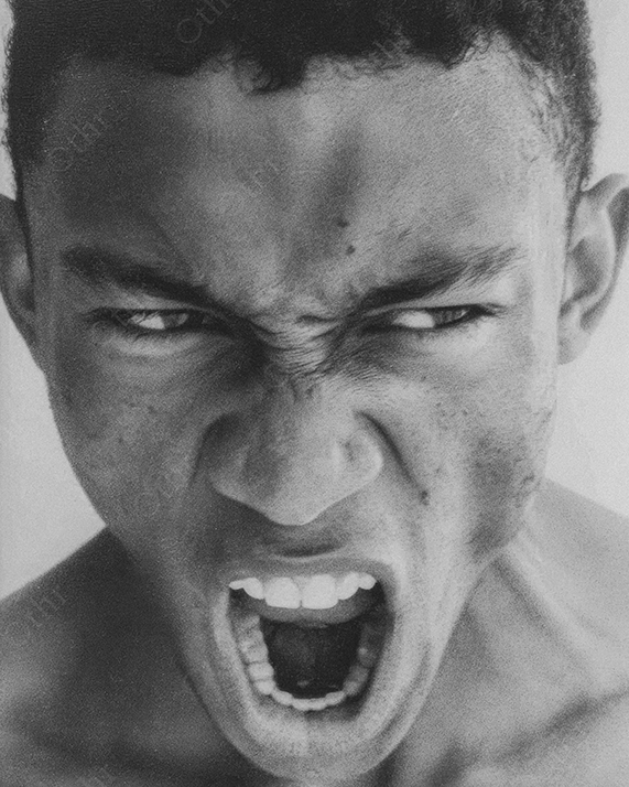 Black and White Close-Up Portrait of Man Screaming With Intense Facial Expression