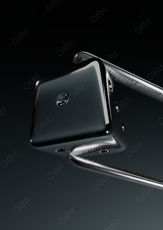 Close-Up of Black Chrome Dice Corner With Glossy Surface and Reflective Edges Against Dark Background – Still Life