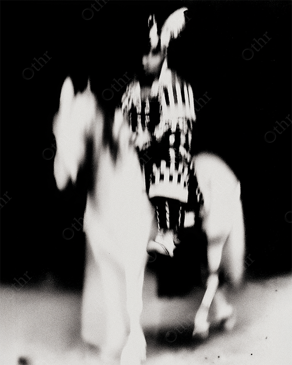Blurred tribal rider in high contrast black and white.