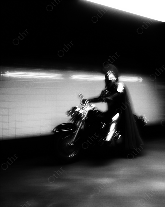 Roman soldier on motorcycle in the subway.