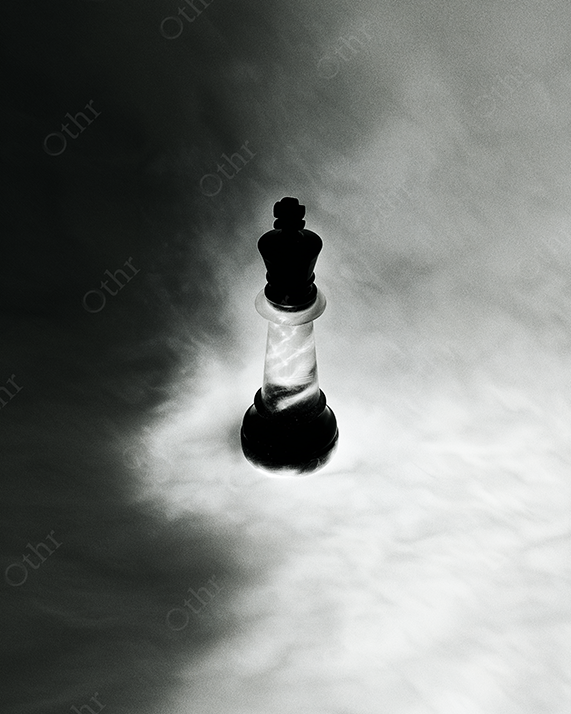 Black king chess piece glowing