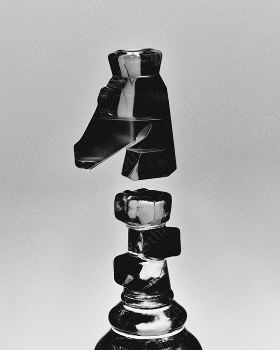 Fragmented black king chess piece in grayscale