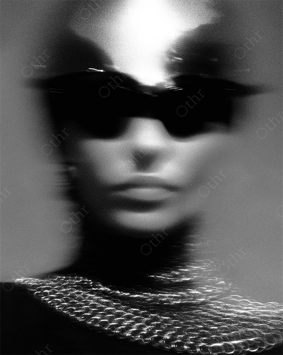 Blurred woman in chainmail armor