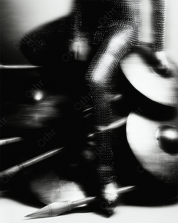 Blurred figure with guitar and chainmail