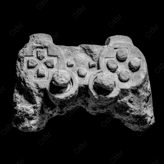 A white stone gaming controller on black background.