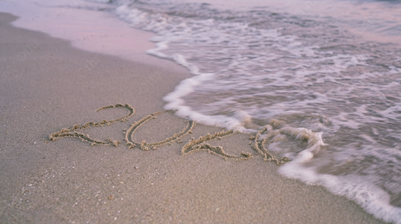 2026 Written in Sand on Beach With Gentle Waves at Shoreline