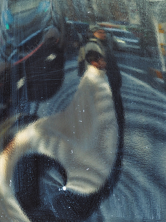 Distorted Reflection of Pedestrian on Curved Glass Surface in Urban Street