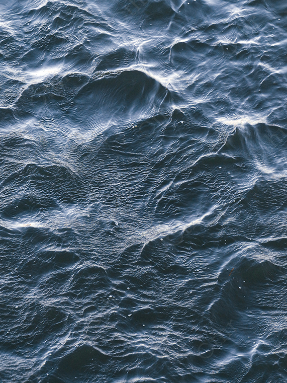 Close-Up of Blue Water Surface with Soft Ripples and Light Texture