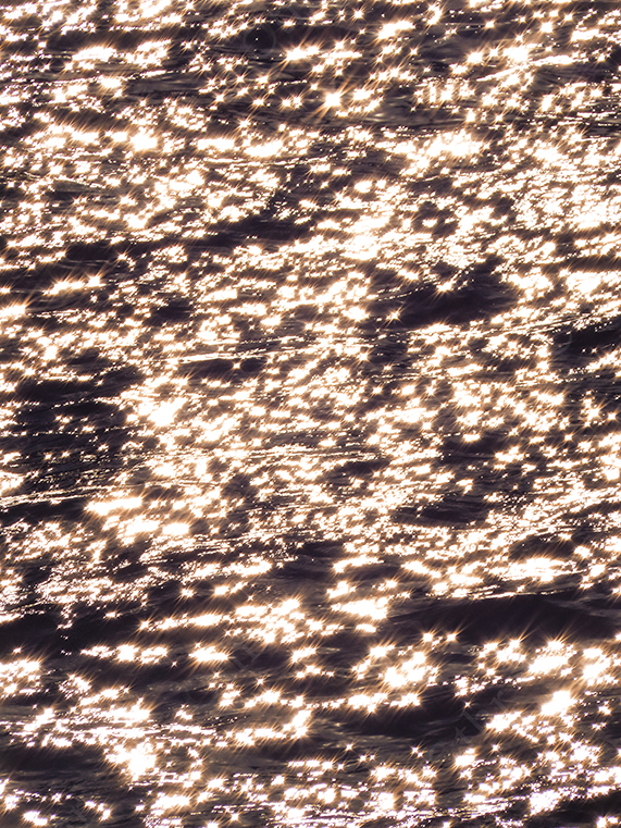 Sunlight Sparkling on Moving Water Creating Bright Reflective Highlights