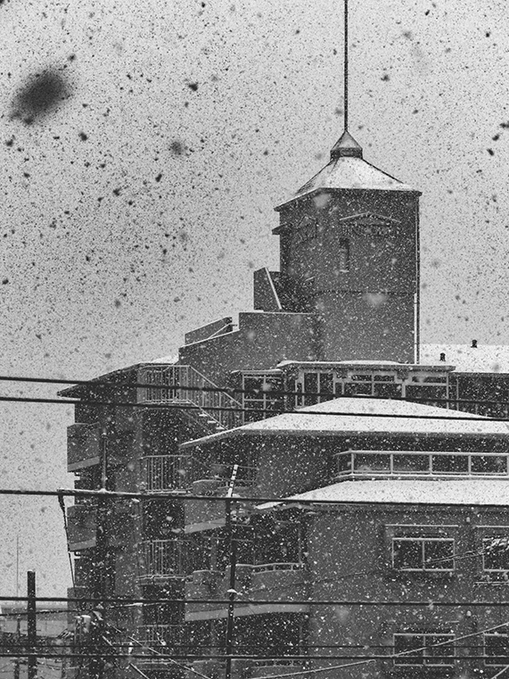 Snowfall Covering Urban Building in Black and White Winter Scene