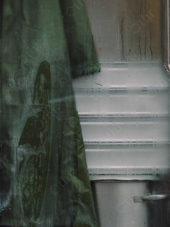 Condensation on Glass Window with Curtain and Blurred Interior Background