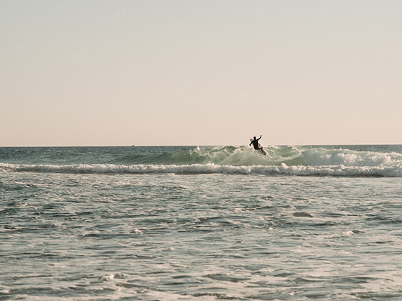 Surfer Performing Turn on Breaking Wave With Open Ocean Background