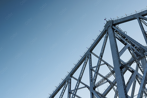Steel Bridge Structure Against Clear Blue Sky With Geometric Lines